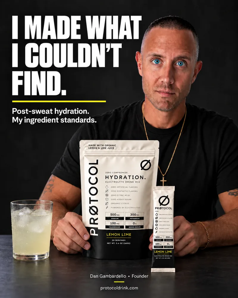 Founder Dan Gambardello seated behind a PRØTOCOL Hydration Lemon Lime bag, a stick pack and a glass of lemon lime drink